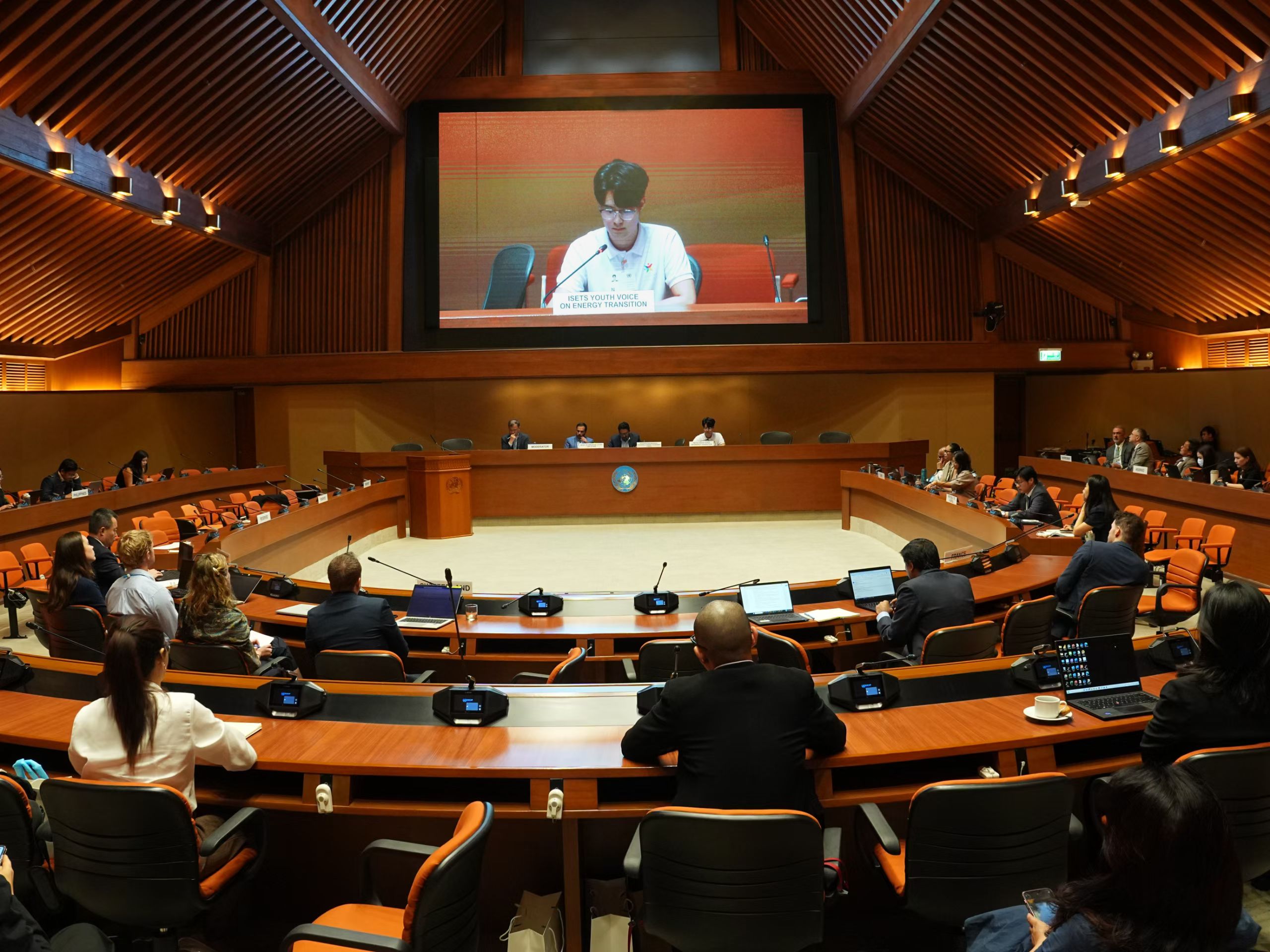 Xingyu Chen speaking at an international policy meeting in Bangkok
