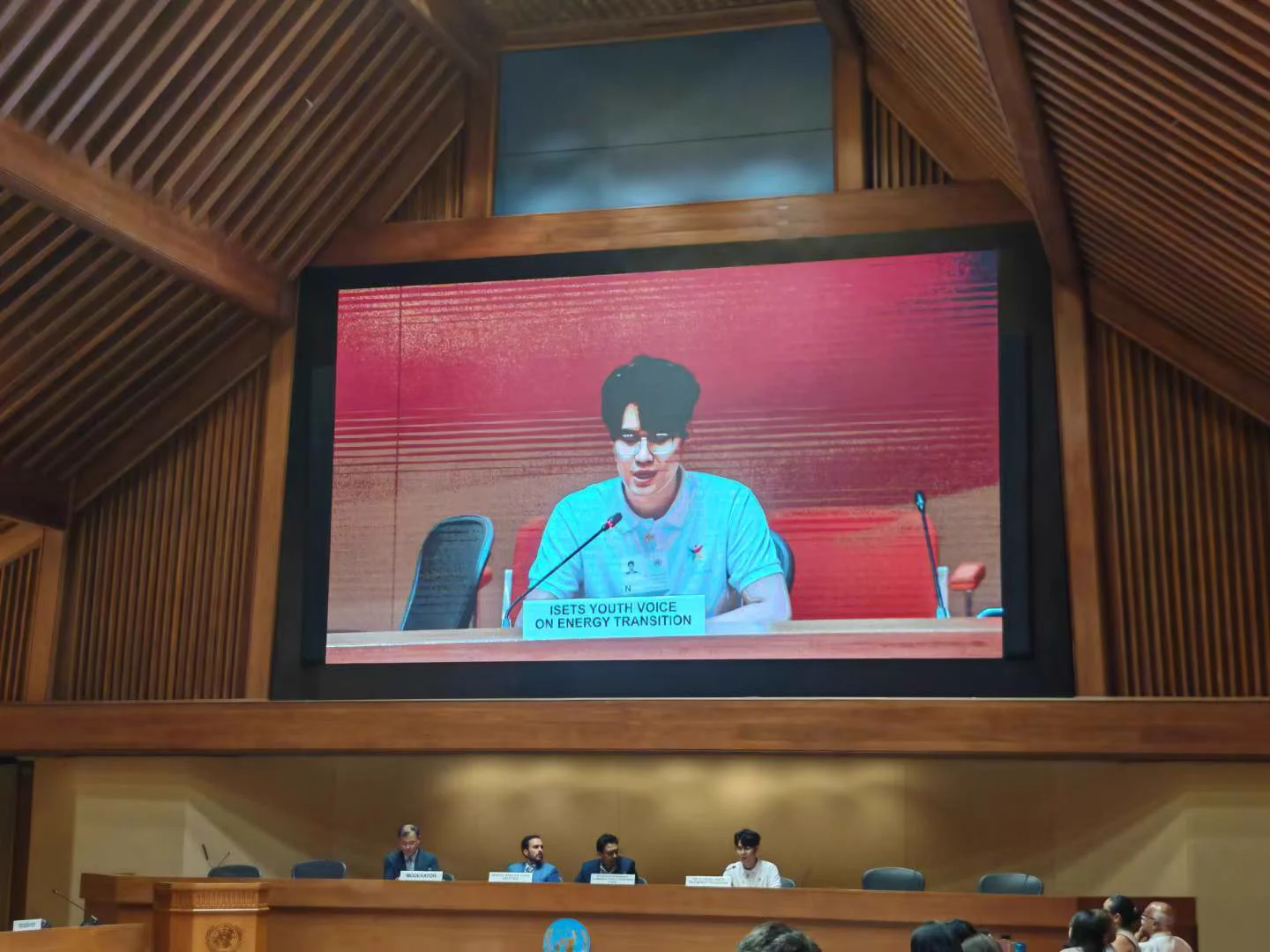 Close-up view of Xingyu Chen delivering the ISETS Youth Voice on Energy Transition presentation