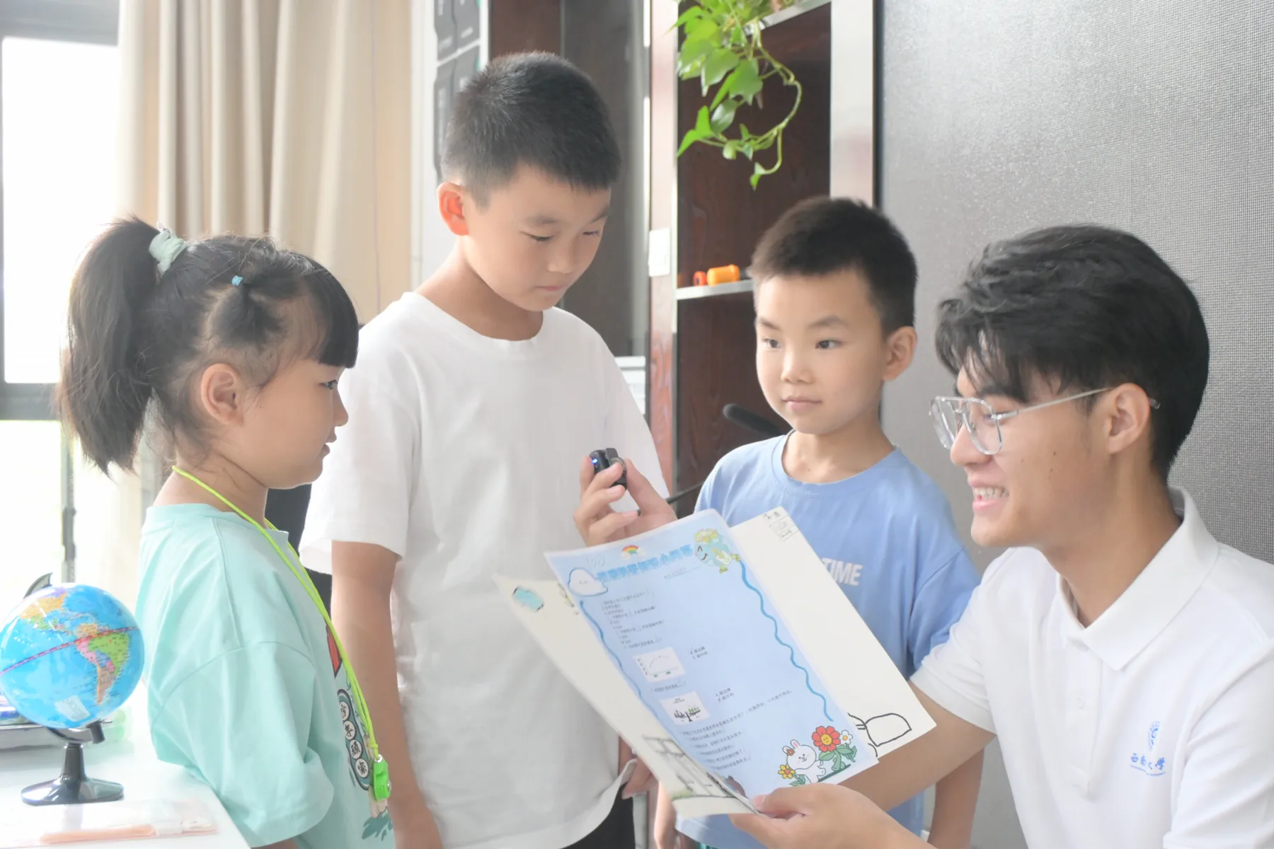 Xingyu Chen discussing an environmental learning project with children